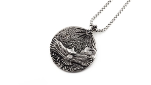 Detailed close-up of eagle pendant necklace with black zircon inlay and box chain