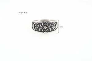 Detailed macro view showing the 12mm gothic engraved pattern on the silver titanium ring