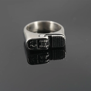 Vintage silver lighter-shaped stainless steel ring for men with reflection on dark surface
