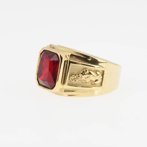 Men's vintage gold plated steel ring featuring a red gemstone and lion relief carvings