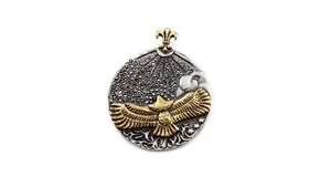 Detailed close-up of eagle pendant featuring gold accents and black gemstone inlay