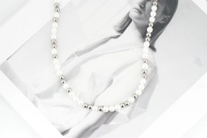 Macro detail of high-quality pearl and silver steel bead alternating strand necklace