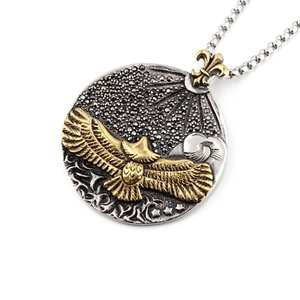 Titanium steel necklace with gold soaring eagle round pendant and fleur-de-lis detail