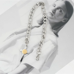 Retro stainless steel Figaro chain necklace with a cross pendant and gold medal detail