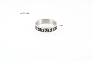 Macro view of silver Viking rune ring showing 5.2mm width and engraved Norse symbols