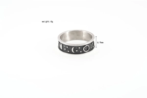 Detail shot of vintage silver titanium ring with celestial moon and star patterns