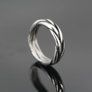 Vintage braided titanium steel twist ring with retro silver finish and oxidized details