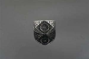 Macro shot of punk style ring featuring vintage sun wheel pattern and textured band design