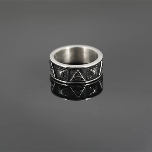 Vintage titanium steel ring with Eye of Providence pyramid symbol on dark background