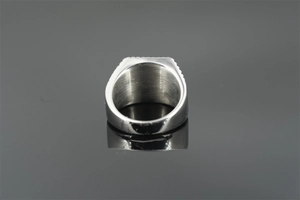 Close-up of a wide minimalist punk style titanium steel ring with industrial polished finish