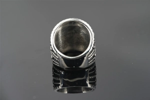 Macro view of vintage titanium steel ring featuring thick band and 3D carved textures