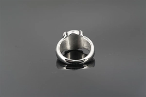 Detailed close-up of a thick silver titanium steel star ring with polished inner band