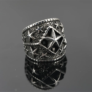 Vintage punk titanium steel ring with star engraving and black mirror reflection