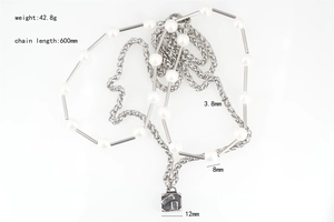 Detail view of pearl and steel necklace with square pendant and 600mm chain length