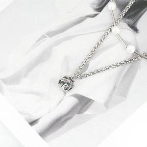 Men's titanium steel necklace featuring a Paris pendant and pearl patchwork design