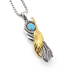 Vintage turquoise feather pendant necklace with silver and gold metal wings in punk style