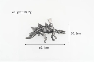 Macro view of vintage silver dinosaur stegosaurus skeleton pendant with dimensions