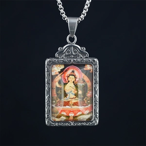Vintage silver Thangka Buddhist pendant necklace with colorful painted deity on black background