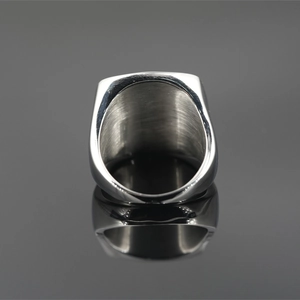 Punk style men's titanium steel signet ring with brushed metal interior and polished edges