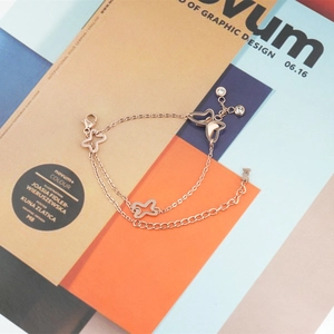 Elegant rose gold double-layer butterfly bracelet with star charms and zircon details