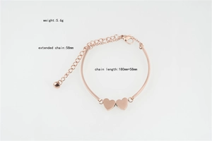 Detailed view of rose gold heart bracelet with lobster clasp and adjustable extension chain