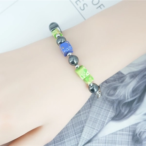 Retro hip hop beaded bracelet featuring grey metallic beads and blue natural stone cubes