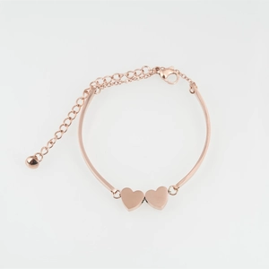 Fashionable rose gold heart bracelet with dual heart charms and adjustable chain extender