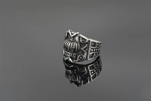 Detailed macro view of vintage titanium crown ring with cross pattern and gothic finish