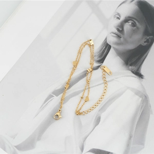 Bracelet de cheville double en acier inoxydable doré avec pendentifs cœur et fermoir réglable