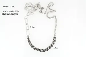 Detailed close-up of mixed Cuban and paperclip chain necklace in silver stainless steel