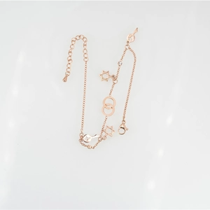Elegant rose gold hexagram and key charm bracelet with lobster clasp and adjustable chain