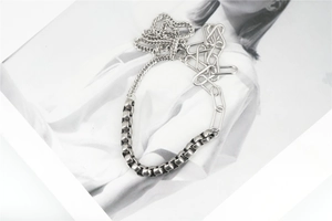 Detail of vintage silver mixed-link Cuban necklace showing industrial chain textures
