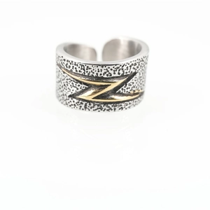 Vintage neutral wide band ring with silver hammered texture and golden lightning bolt motif