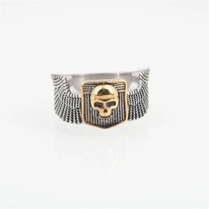 Punk gothic skull ring with golden relief and silver wings on stainless steel band