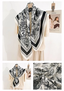 Detail of French toile de jouy print scarf with vintage lion pattern and herringbone texture