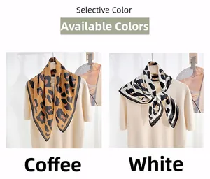 Detail of leopard print silk scarves in coffee and white with delicate black stitched edges