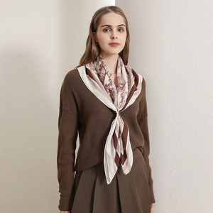 Vintage lion print silk scarf with brown herringbone pattern worn by a model