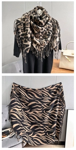 Detail shot of leopard and zebra print fringe scarves with premium cashmere texture