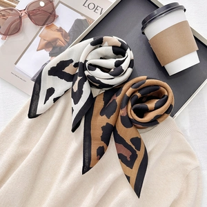 Fashion leopard print scarves in brown and monochrome styles on casual lifestyle set