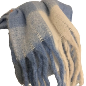 Blue and white checkered winter scarf with thick tassels for stylish warmth