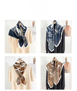 Detail view of abstract printed faux silk scarves styled with casual knitwear outfits