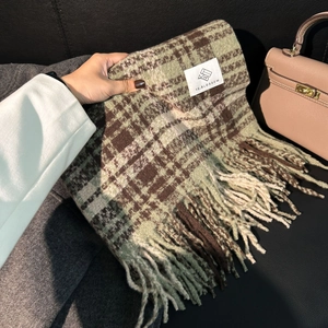 Thick green and brown plaid winter scarf with long fringe and branded textile label