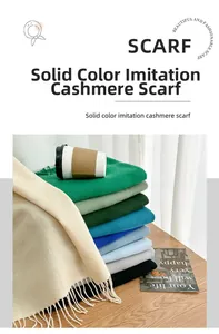 Macro shot of colorful imitation cashmere scarves with soft fringe details in a warm setting