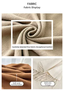 Detailed macro view of soft cashmere texture and twisted tassel edges of the warm scarf