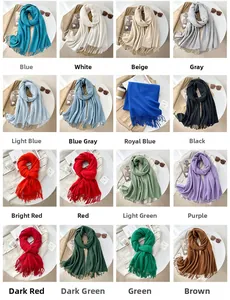 Collage of soft cashmere-feel scarves in 16 assorted colors with elegant fringe details