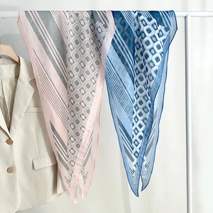Fashionable geometric print silk scarf in pink and blue tones for women's accessory