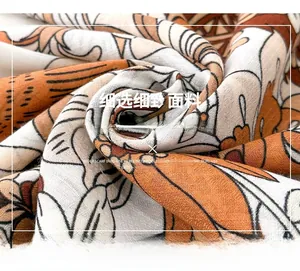 Detailed view of wide printed scarf fabric with vintage floral pattern in mercerized wool