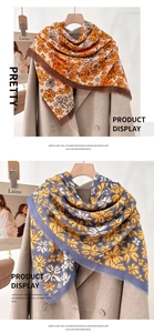Detailed texture of 130cm mercerized wool scarves with vintage floral print and frayed edges