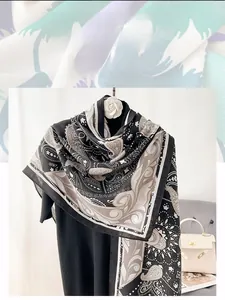Close-up of lightweight cotton and linen scarf featuring detailed paisley patterns