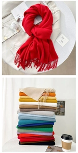 Detailed view of soft cashmere-feel scarves with classic tassels in various vibrant colors